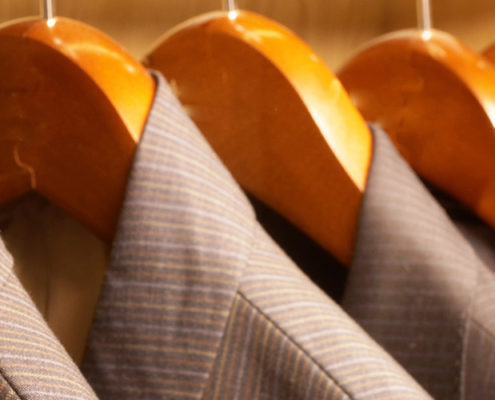 Suits hanging in a row. IT marketing shouldn't be skimped on.